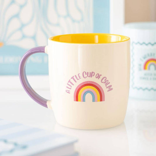 colourful rainbow mug with pink handle and yellow interior
