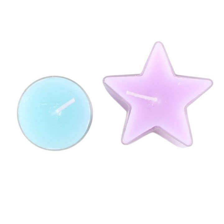 Two small tea light candles on a plain white background: one round candle in light blue and one star-shaped candle in pale pink/lilac.