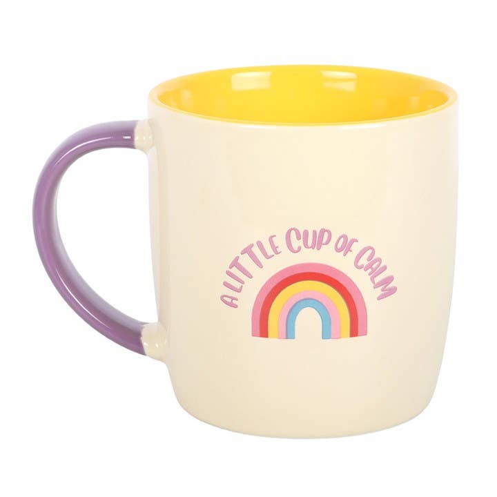 colourful rainbow mug with pink handle and yellow interior