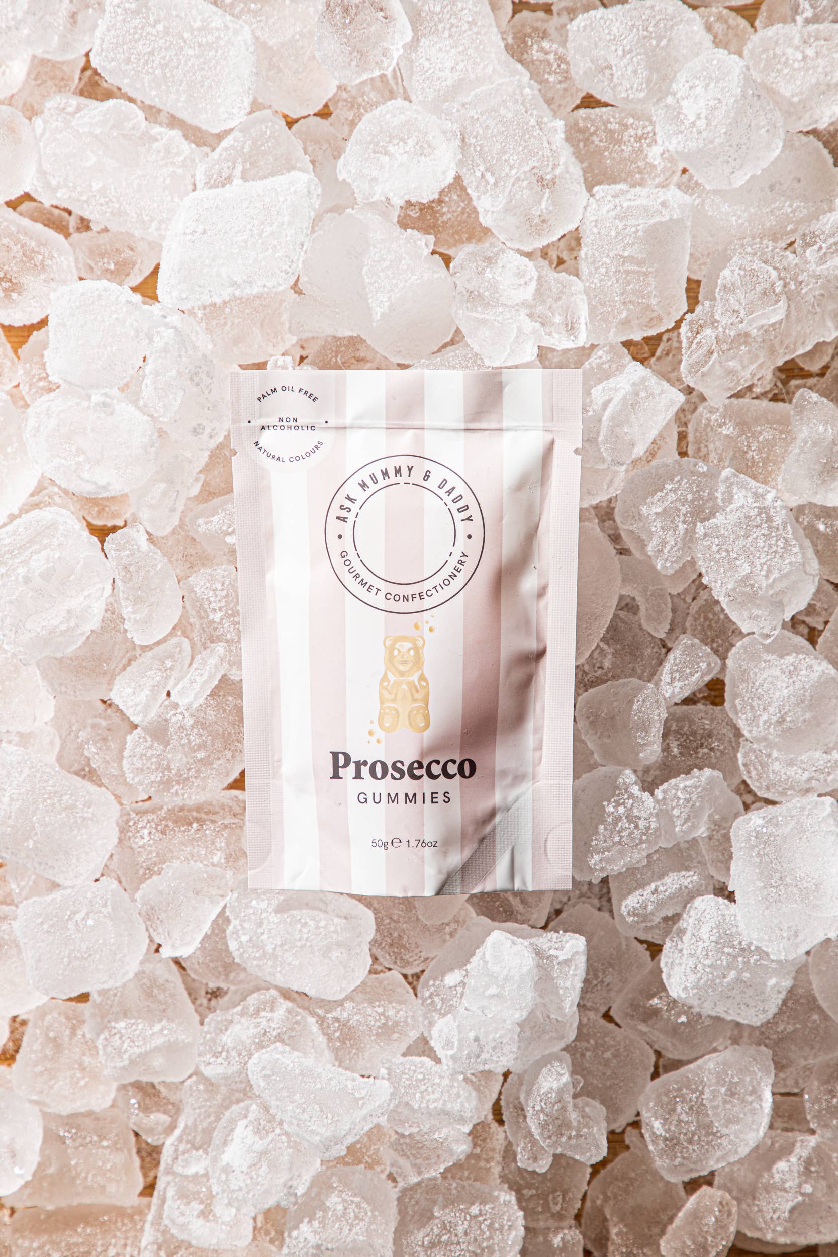 Pack of Prosecco gummies on a bed of ice cubes