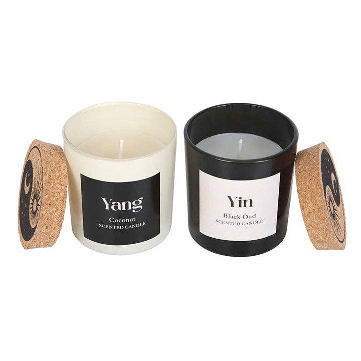 Two scented candles labeled 'Yang' and 'Yin' on a white background.